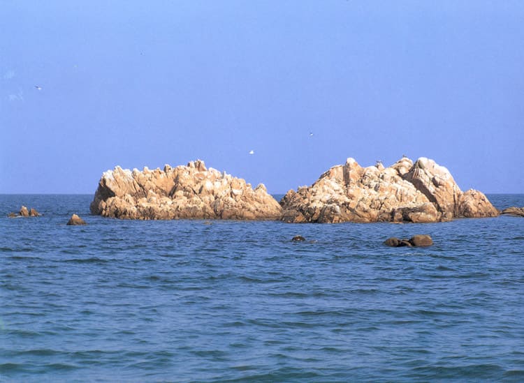 A distant view of Daewangam on a calm East Sea — the waters the Manpasikjeok legend promised to quiet