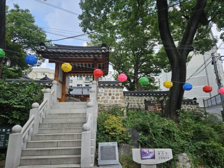 Steps and entrance gate with colorful paper lanterns leading to King Gongmin's Shrine in Mapo, Seoul