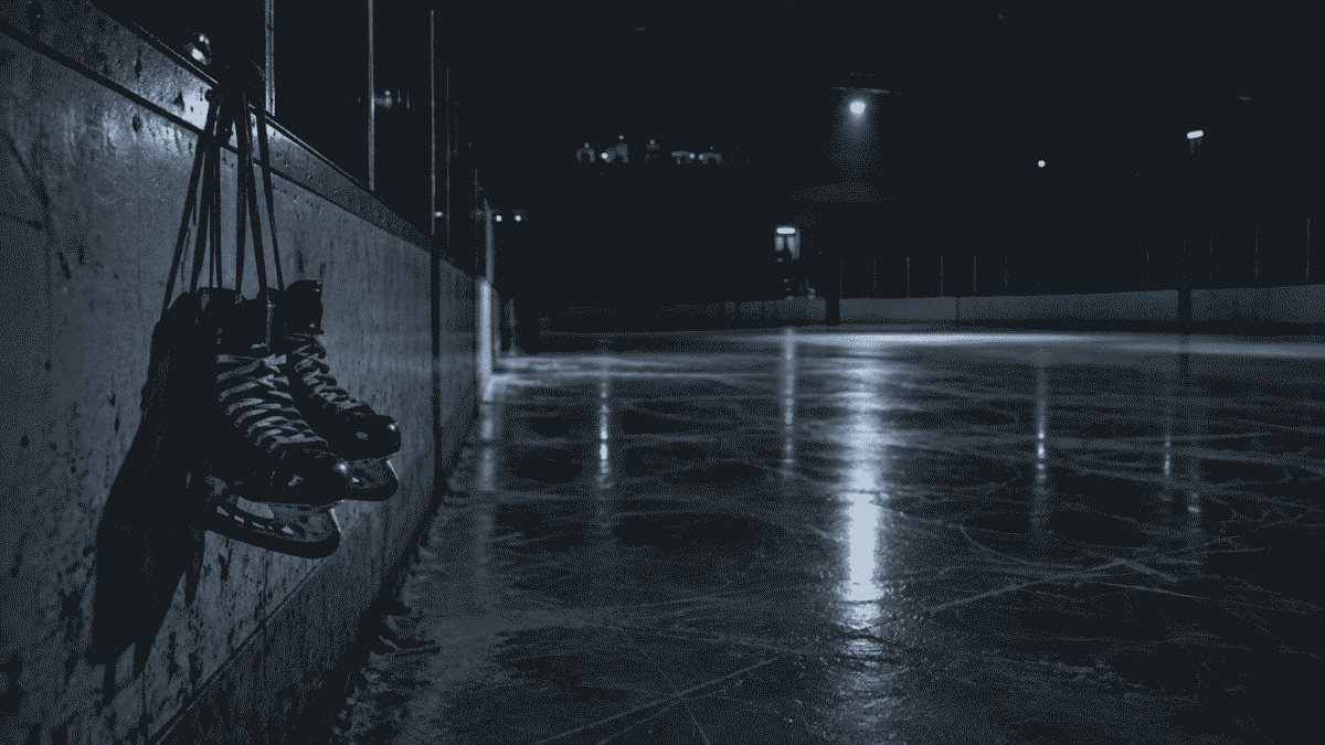 Empty ice rink with abandoned skates, representing the young athletes punished under the North Korea language law