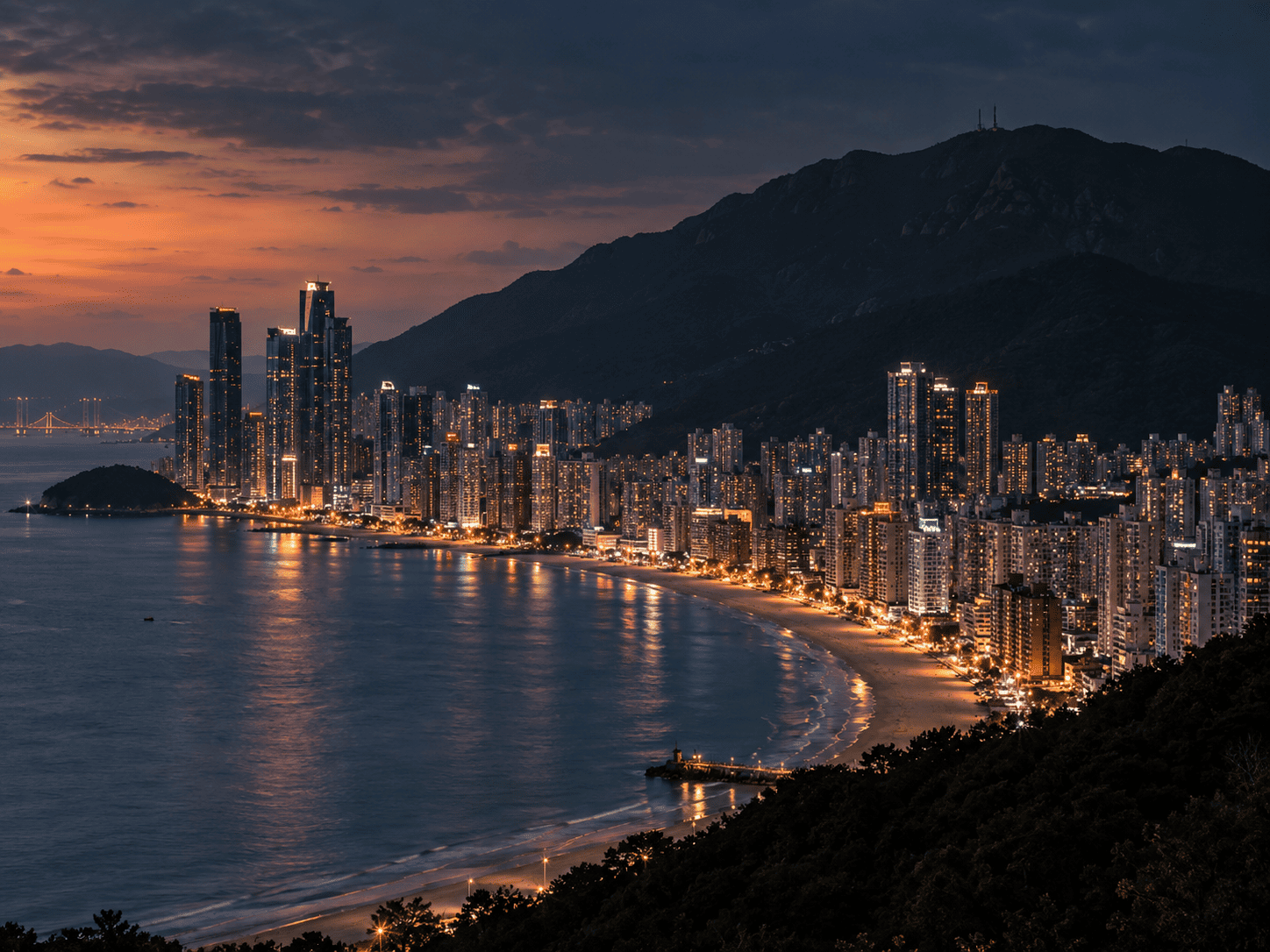 Busan's Haeundae district with Mount Jangsan rising behind it, home of the Jangsan Tiger legend