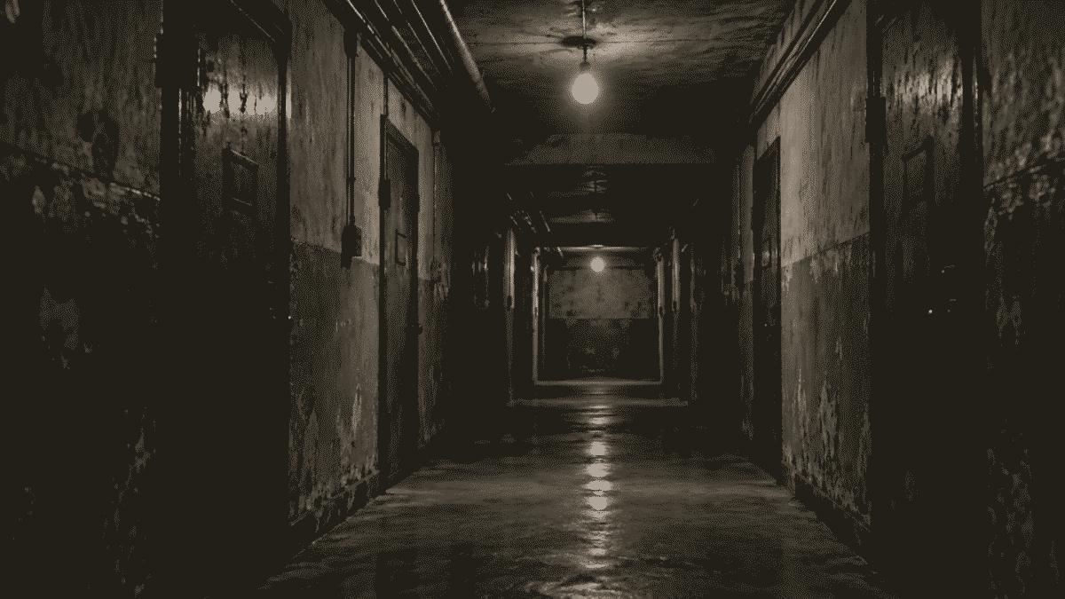 Dim basement corridor with metal doors, evoking Korean CIA interrogation rooms at Namsan
