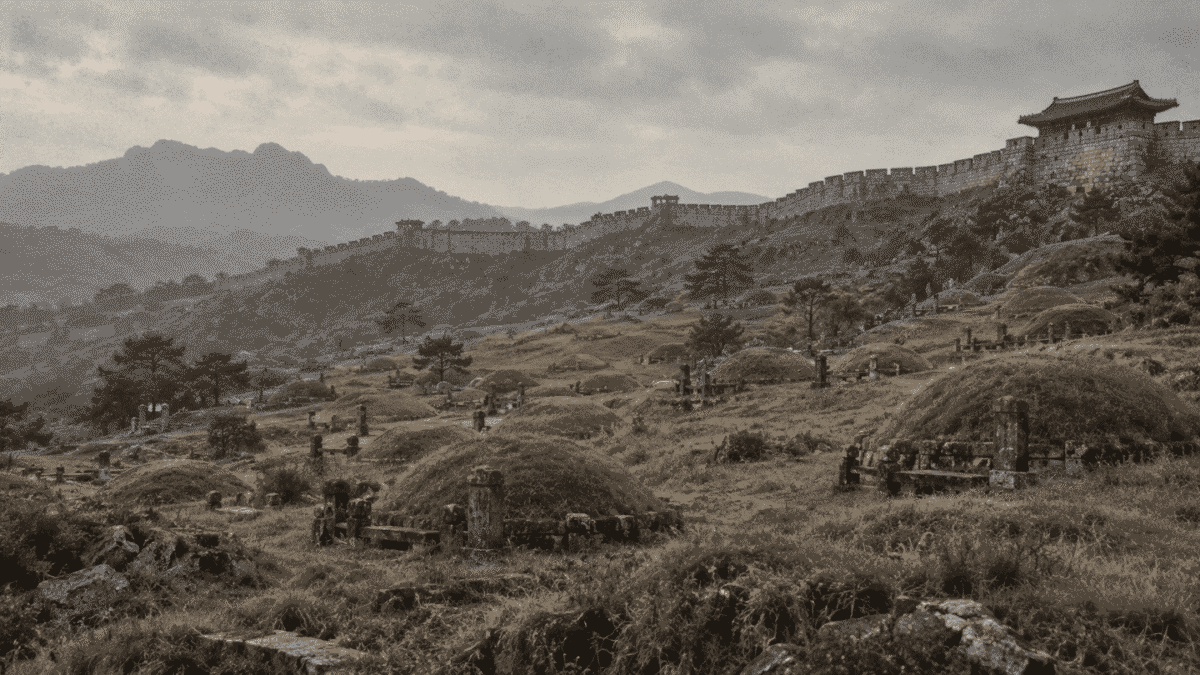 Traditional grave mounds on hillsides outside old Seoul’s city wall, the history behind Korean school ghost stories